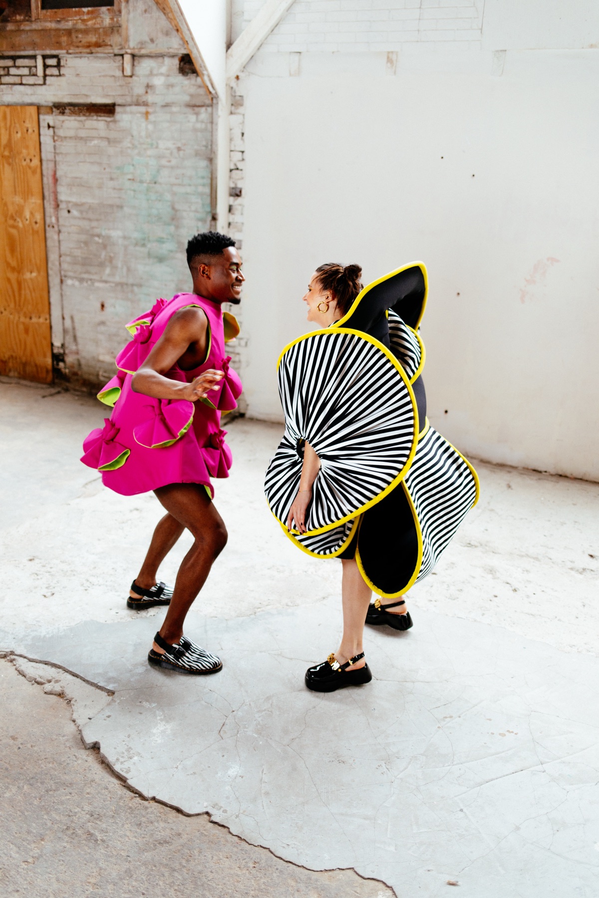 Nadine Colijn digital fashion — two models mid-movement in sculptural looks
